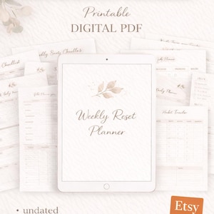 May include: A digital planner with a minimalist design. The image shows a tablet displaying a "Weekly Reset Planner" with a floral accent. Additional planner pages are visible, along with the text "undated", "clean girl aesthetic", and "minimal and aesthetic".