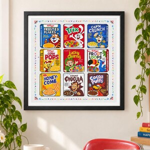 Op de afbeelding: Een ingelijst kruissteek kunstwerk met een raster van negen klassieke ontbijtgranendozen, waaronder Frosted Flakes, Trix, Cap'n Crunch, Corn Pops, Lucky Charms, Froot Loops, Honeycomb, Count Chocula en Cocoa Puffs met hun iconische mascottes.