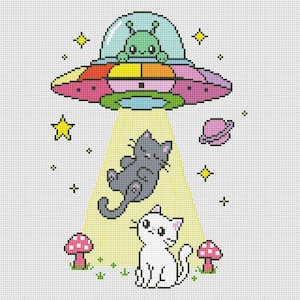 May include: A cross-stitch pattern featuring a green alien in a colorful UFO beaming up a gray cat. A white cat sits below near two pink mushrooms. The scene includes yellow stars and a small pink planet against a white grid background.