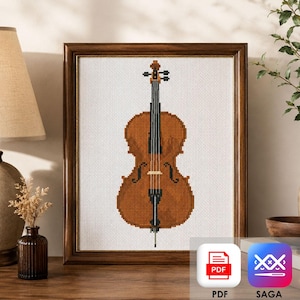 Puede incluir: Un patrón de punto de cruz enmarcado que presenta un violonchelo marrón centrado sobre un fondo de cuadrícula blanca. El violonchelo tiene un mástil oscuro, un diapasón negro y una pica plateada. La obra está en un marco de madera marrón oscuro.