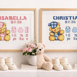 May include: Two framed cross-stitch baby announcements. One reads "ISABELLA" with a pink bear, the other "CHRISTIAN" with a blue bear. Both include birth date, time, weight, and length in inches and ounces. Soft toys and baby booties are in the foreground.