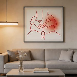 May include: A framed art print featuring a minimalist line drawing in red. The artwork depicts a stylized representation of two figures in an intimate embrace. The background is a neutral beige, and the frame is black.