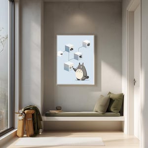 May include: A framed wall art print featuring a light blue background with a gray cartoon creature standing next to a floating white cube. The cube displays a code symbol, and several other white cubes with various icons are connected by lines.