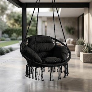 May include: A black hanging chair with a round woven frame and a plush, tufted cushion. The chair is suspended by thick black ropes and features a fringe along the bottom. The chair is designed for outdoor use.