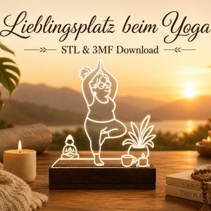 May include: An illuminated LED lamp depicting a yoga pose, a small Buddha, and potted plants. The lamp is on a wooden base, with the text "Lieblingsplatz beim Yoga" and "STL & 3MF Download". The background shows a sunset over a lake and mountains.