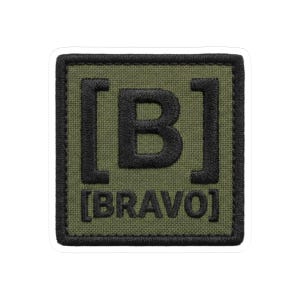 May include: Square sticker with a green background and a black border. The sticker features the letter "B" in black, enclosed in brackets, with the word "BRAVO" below, also in black. The sticker has a white border.