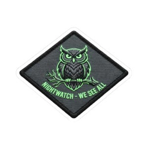 May include: A diamond-shaped patch with a black border. It features a green and black owl on a branch, with the text "NIGHTWATCH - WE SEE ALL" in green. The owl has glowing green eyes and outlines.