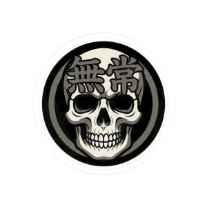 May include: A round sticker featuring a detailed skull illustration in shades of gray and white, set against a black background. The Japanese characters "Mutou" are above the skull.