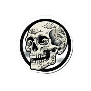 May include: A sticker featuring a detailed illustration of a skull with stylized cloud and wave designs. The skull is white with black shading, set against a black and white circular background. The design has a tattoo or graphic art aesthetic.