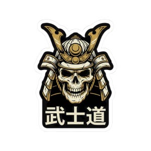 May include: A sticker featuring a detailed illustration of a skull wearing a samurai helmet. The helmet is gold and beige, with intricate details. The skull has a menacing expression. Below the skull is Japanese text in a white rectangle.