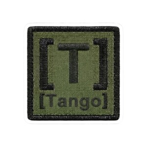May include: Square patch with a green background and black border. The patch features the letter "T" inside brackets, with the word "Tango" below. The patch has a textured appearance.