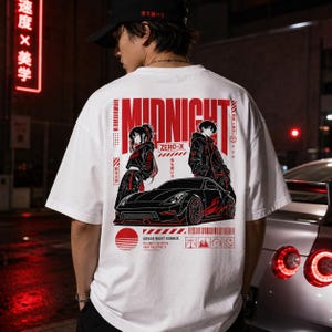 May include: White t-shirt with a large graphic featuring the word "MIDNIGHT" in red, along with anime-style characters and a black sports car. The shirt also includes the text "ZERO-X" and "URBAN NIGHT RUNNER."