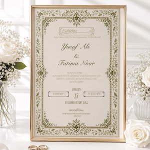 May include: A rectangular wedding invitation in a gold frame featuring green floral borders and black text. The invitation displays the names Yusuf Ali and Fatima Noor, the date January 25, and the location Al Rahman Event Hall, with two gold rings.