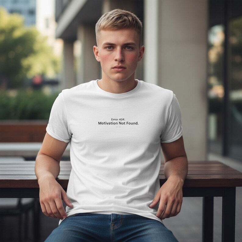 May include: A white ceramic mug with a black handle and the text "But First, Coffee" in a bold, black font. The mug is set against a neutral background, highlighting its simple design.