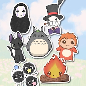 May include: A selection of anime-style character stickers in various colours. The stickers include a black cat, a large grey creature, a faceless figure, a character with a top hat, a red-haired character, a campfire, and several small, fluffy creatures.