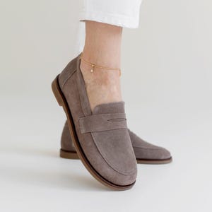 A stylish comparison of sand and chocolate brown premium suede loafers, showing their clean lines