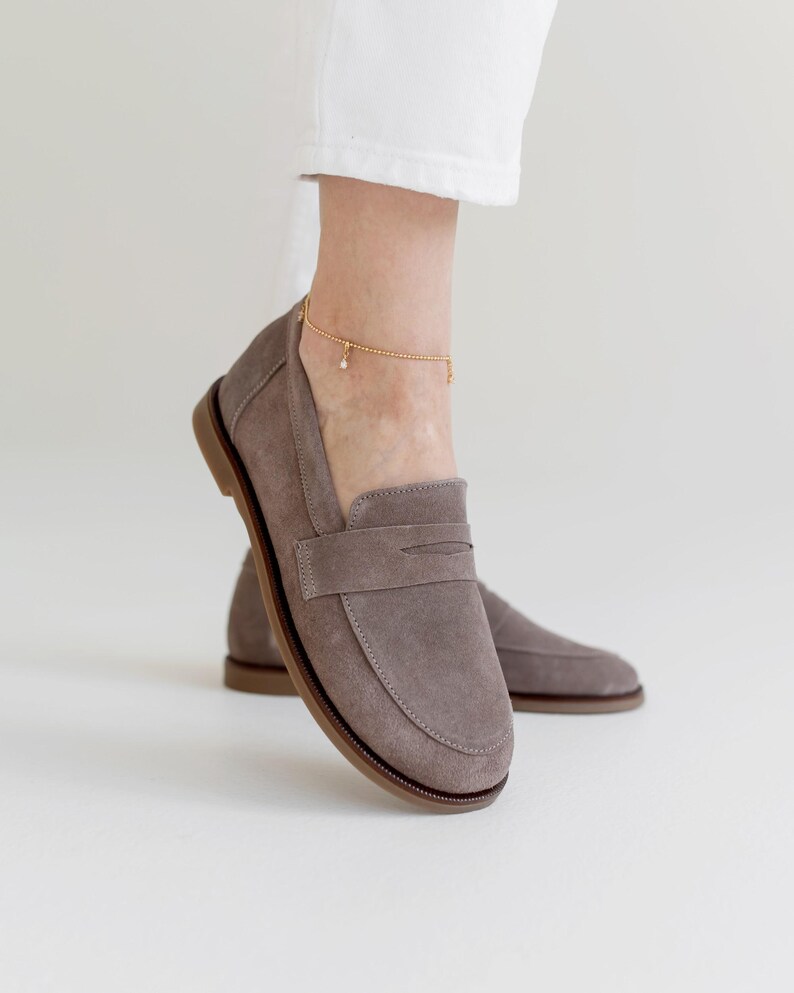 A stylish comparison of sand and chocolate brown premium suede loafers, showing their clean lines