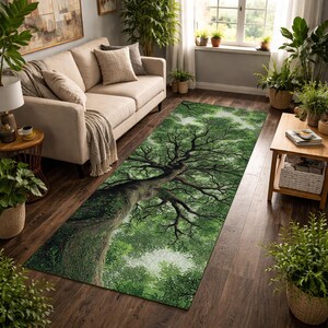 May include: A rectangular area rug featuring a detailed illustration of a large tree with a sprawling canopy. The rug's design showcases a vibrant green color palette, with the tree's trunk and branches in darker shades. The rug is placed in a living room setting.
