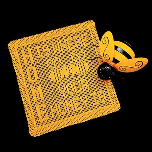 May include: A yellow crocheted doily with the words "Honeycomb" written in the center. A yellow and black bee figurine is on top of the doily.