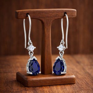 dark blue sapphire carved fish hook Sapphire Hook