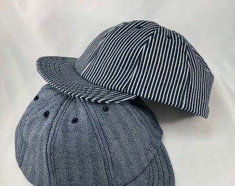 Herringbone or hickory stripe denim eight panel caps. Short visor. Absolutely any size.