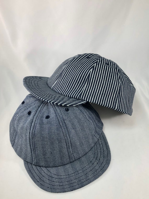 Herringbone or hickory stripe denim eight panel caps. Short visor. Absolutely any size.