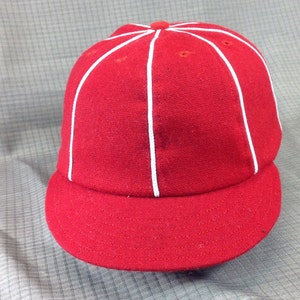 Select your cap color in melton wool 8 panel cap with short 1910 visor, white soutache on seams. Custom made in any size.
