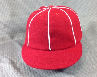 Select your cap color in melton wool 8 panel cap with short 1910 visor, white soutache on seams. Custom made in any size.