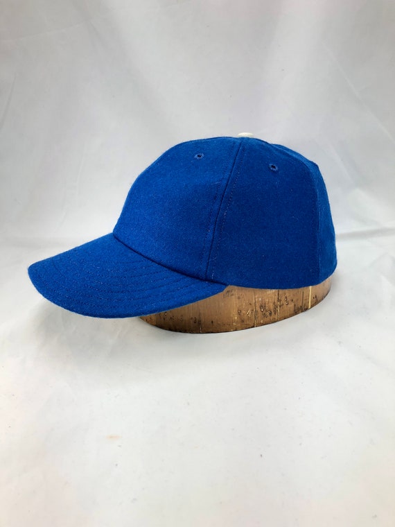 Royal blue melton wool 6 panel cap with 3” visor. Any size available. Select at checkout. Made to order.