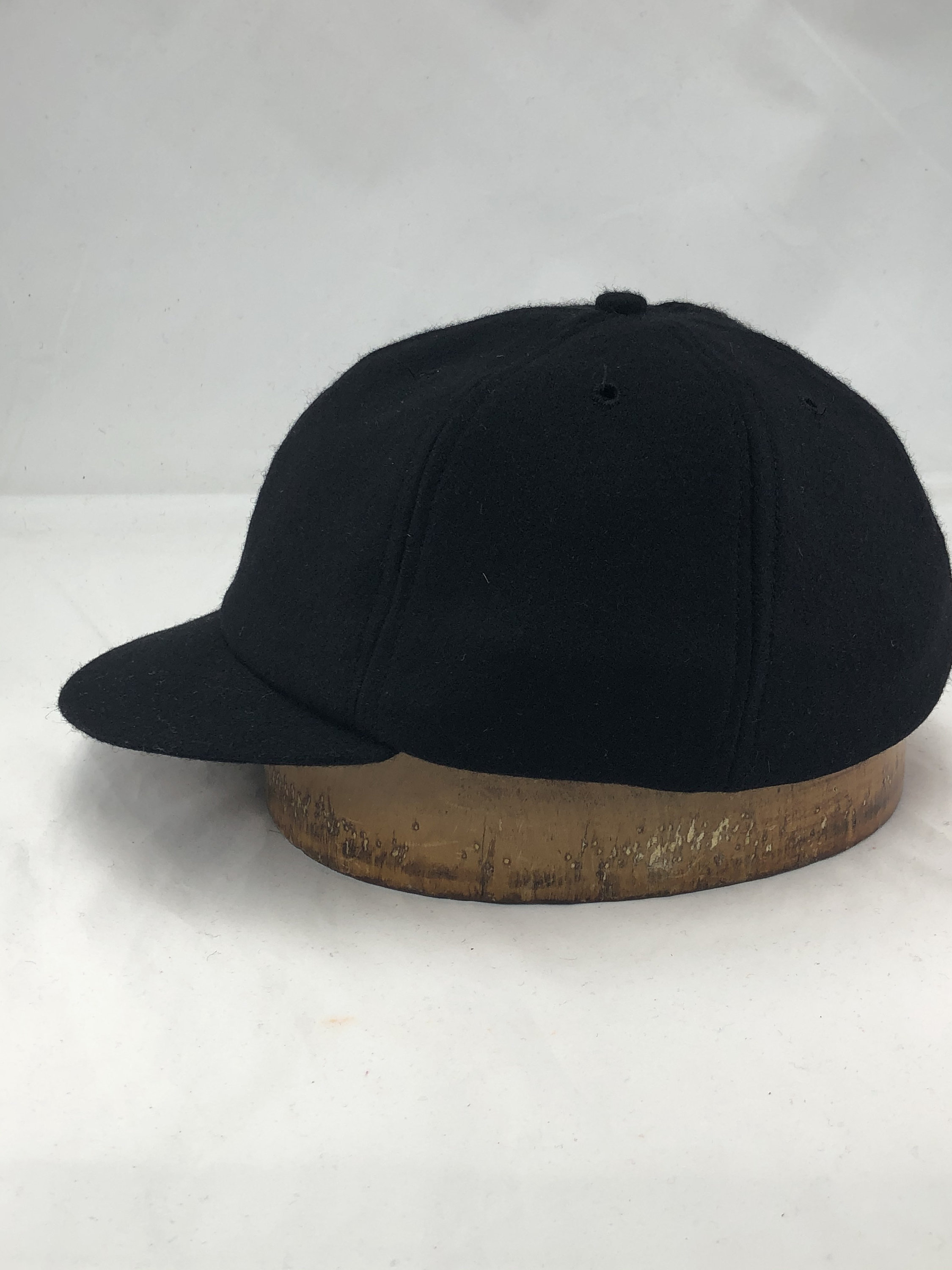 Black wool flannel 6 panel cap with 2” visor. Custom made to order ...