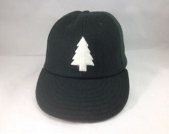 Felt Pine tree logo on wool flannel cap. Chose cap color and size at checkout! Hand crafted to order.