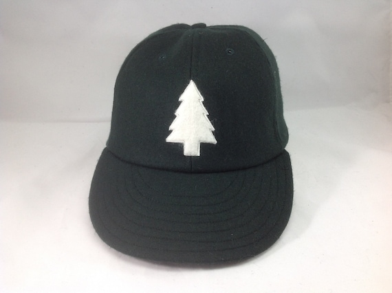 Felt Pine tree logo on wool flannel cap. Chose cap color and size at checkout! Hand crafted to order.