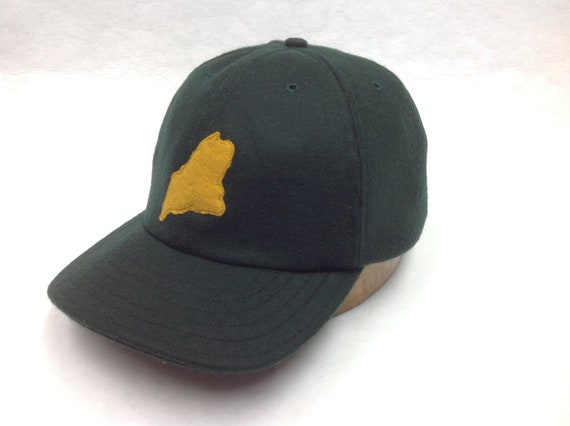 Dark Green 6 panel wool cap with felt state of Maine logo, hand cut and stitched, 2.5 inch visor.  Any size available.