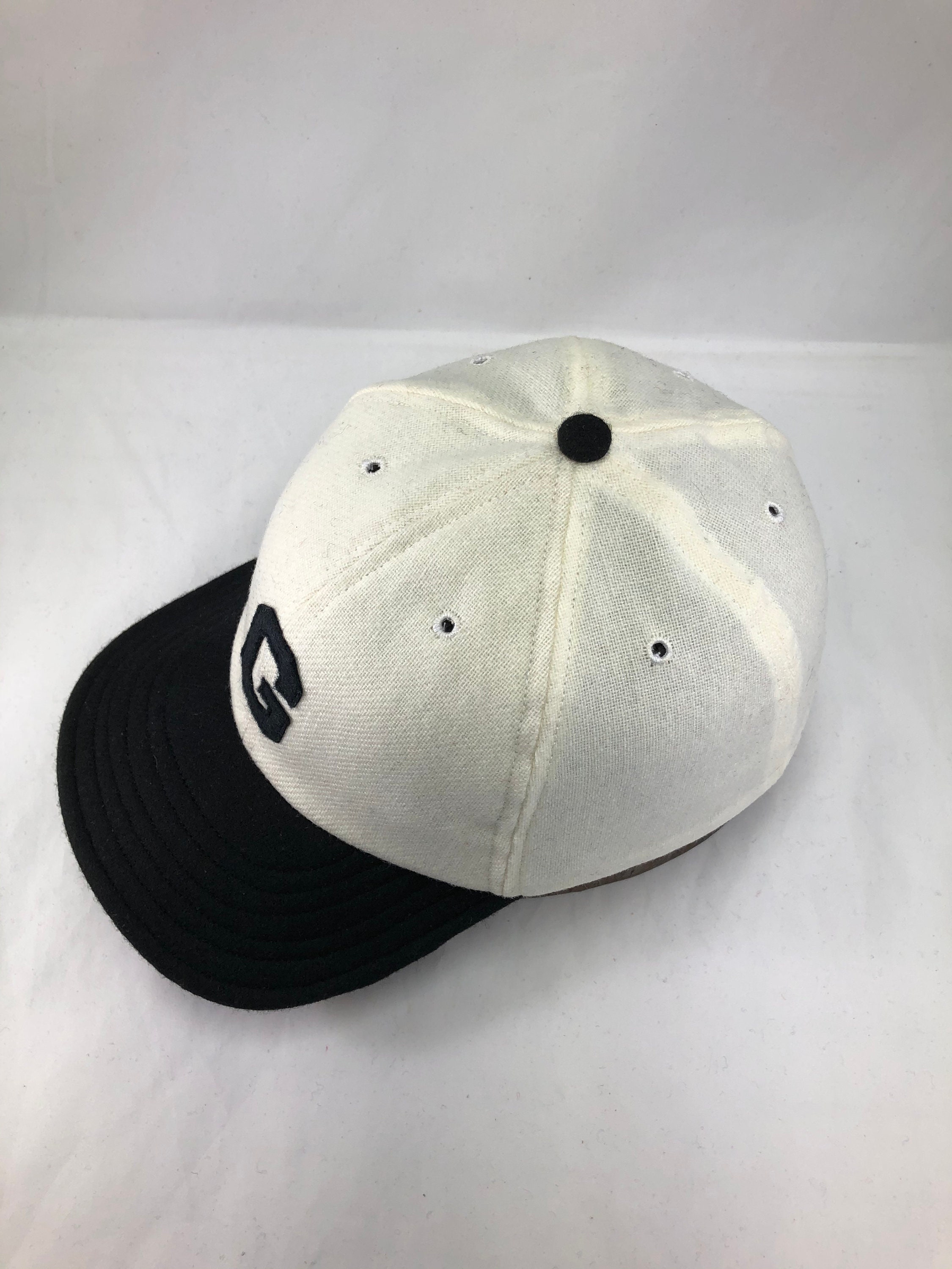 White wool flannel 6 panel cap, black 2 1/2 in. visor. Hand cut Black G ...