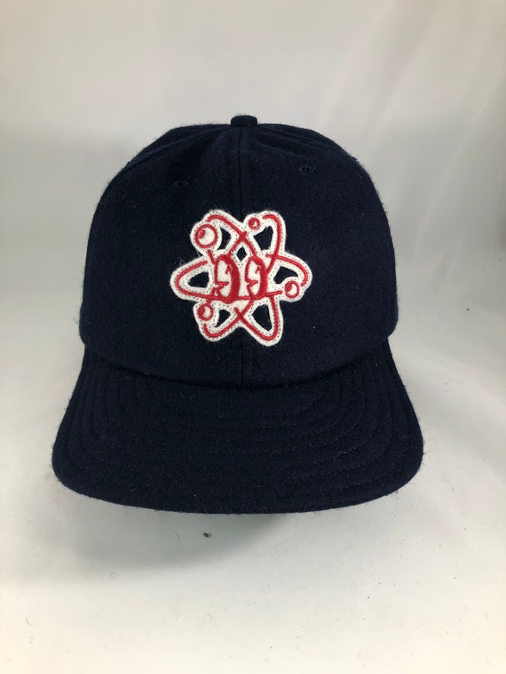 Atom felt patch cap, art by Russell Balliet. Navy Melton wool 6 panel cap with 2.5” visor. Any size available. Cotton sweatband.