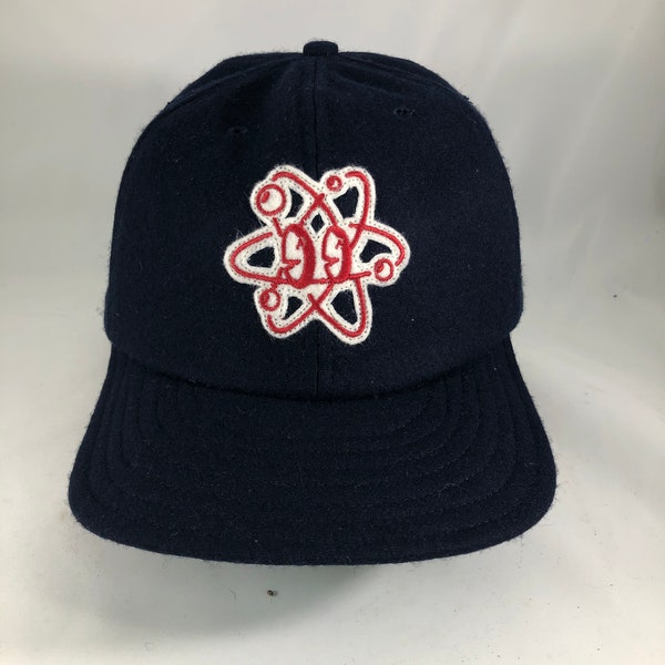 Atom felt patch cap, art by Russell Balliet. Navy Melton wool 6 panel cap with 2.5” visor. Any size available. Cotton sweatband.