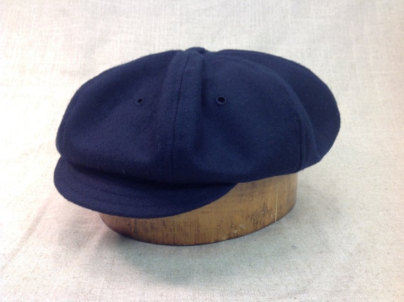 Hand crafted, navy melton wool 8 panel baggy cap, long or short visor, adjustable or fitted with cotton or leather sweatband.