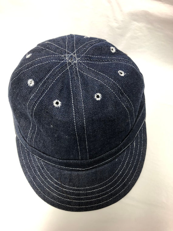 8 panel mechanics cap in indigo denim, soft visor, white topstitching, eyelets, no  top button. Any size available, select at checkout