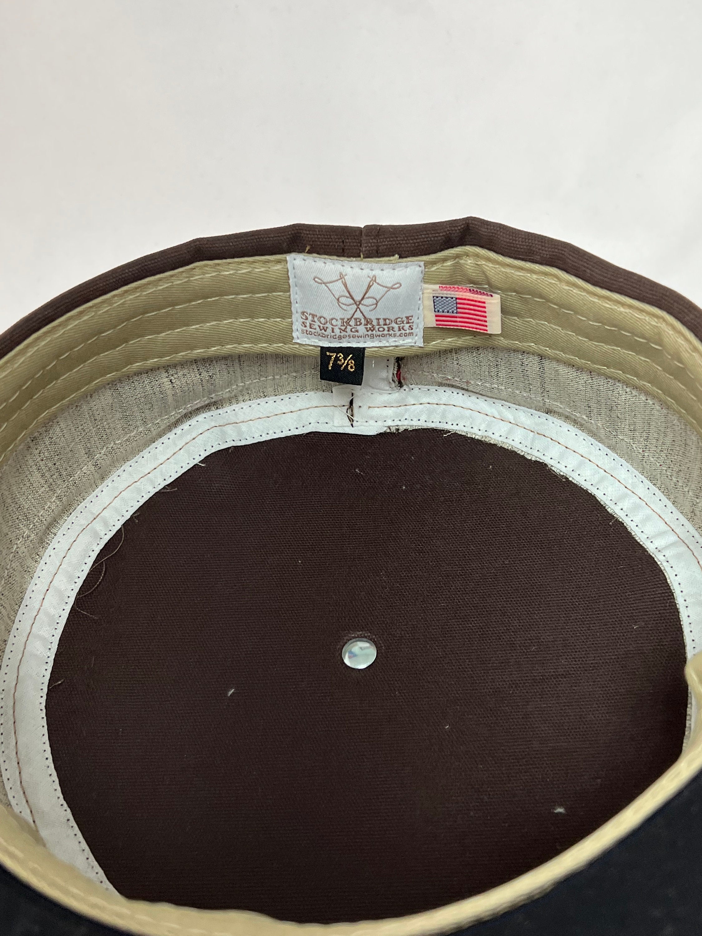 Brown cotton twill boxcap with Black 2.5” visor, yellow Brown cotton twill boxcap with Black 2.5” visor, yellow