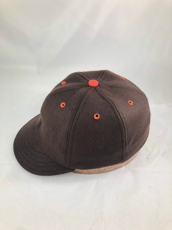 Pick Out Your Accent Colors -  On our 6 panel brown melton wool cap with contrasting accent color eyelets and button.