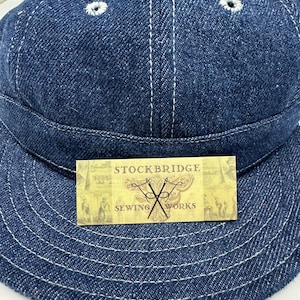 8 panel mechanics cap (shown - indigo denim) soft visor, white topstitching, eyelets, no  top button. Any size available, select at checkout