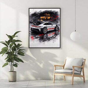 May include: Framed art print featuring a white sports car with red and black accents, and the text "GT3 RS". The artwork has a dynamic, abstract style with splashes of red and black, and a second yellow car in the background.