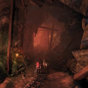 May include: A digital illustration of a dark, cavernous mine tunnel with jagged brown rock walls, wooden support beams, and a rusted metal rail track running through the center. Two figures and a small animal walk along the tracks toward a glowing orange light.