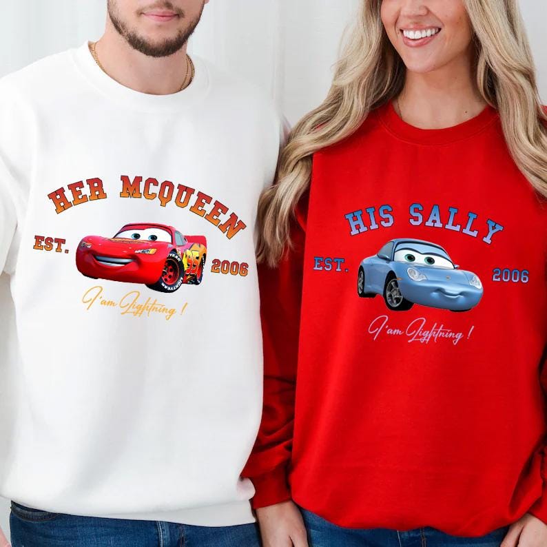 May include: White and red sweatshirts with matching car graphics. The white sweatshirt features a red car with the text "Her McQueen" and "I'am Lightning!" The red sweatshirt has a blue car with "His Sally" and "I'am Lightning!"