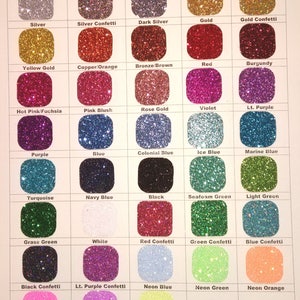 May include: A color chart showing 36 different colors of glitter vinyl. The colors are arranged in rows and columns, and each color is labeled with its name. The colors include silver, gold, red, blue, green, purple, pink, black, white, and more.