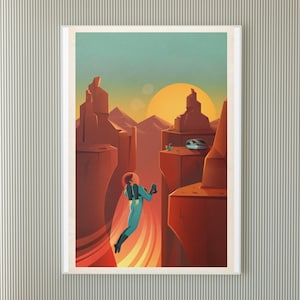 May include: A framed art print depicting a retro-style space scene. A figure in a teal spacesuit is falling through a canyon, with a large orange sun in the background. The artwork features red rock formations and a teal sky.