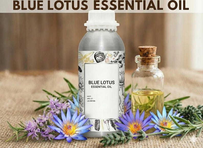 May include: A silver bottle labeled "BLUE LOTUS ESSENTIAL OIL" stands beside a small glass bottle with a cork stopper. The bottles are surrounded by blue lotus flowers, purple flowers, and green sprigs. The background is a light brown.
