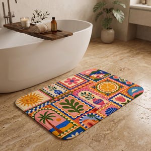 May include: A rectangular bath mat featuring a vibrant, multi-coloured grid pattern of various illustrations, including a yellow sun, a palm tree, a citrus slice, floral motifs, and architectural elements in shades of pink, blue, orange, and green.