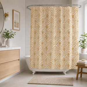 May include: Cream-colored shower curtain with a repeating pattern of stylized, fan-shaped designs in a warm, golden-brown hue. The pattern creates a textured, layered effect, adding visual interest to the bathroom decor.