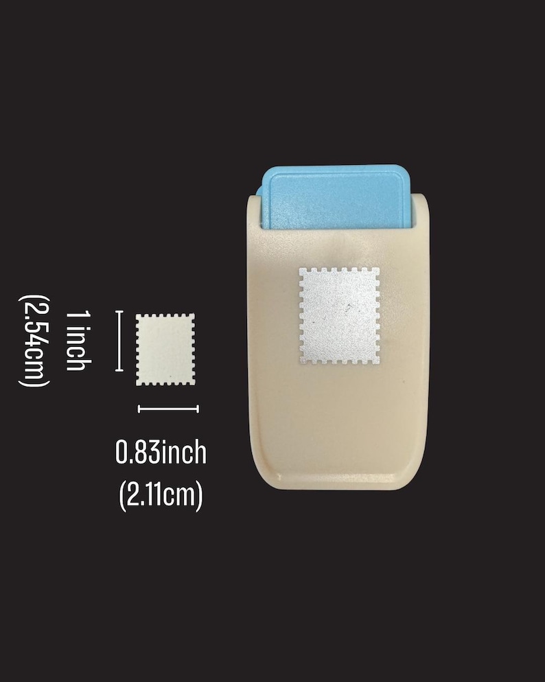 May include: A beige and light blue craft paper punch with a rectangular body and a lever mechanism. The punch creates a stamp-shaped cutout measuring 1 inch (2.54 cm) in height and 0.83 inches (2.11 cm) in width, as indicated by the text.